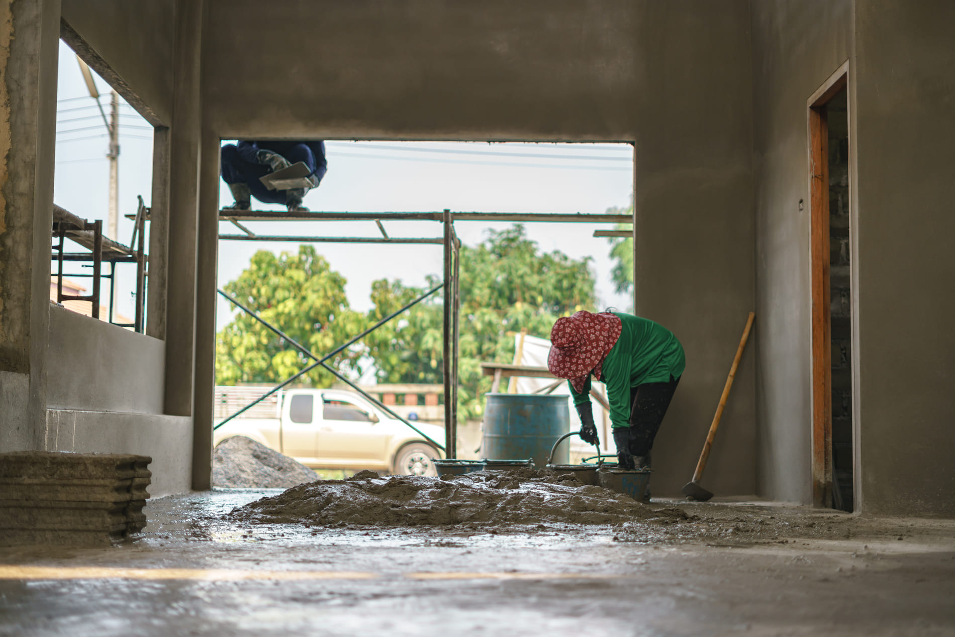 asian-worker-labor-working-with-concrete-cement